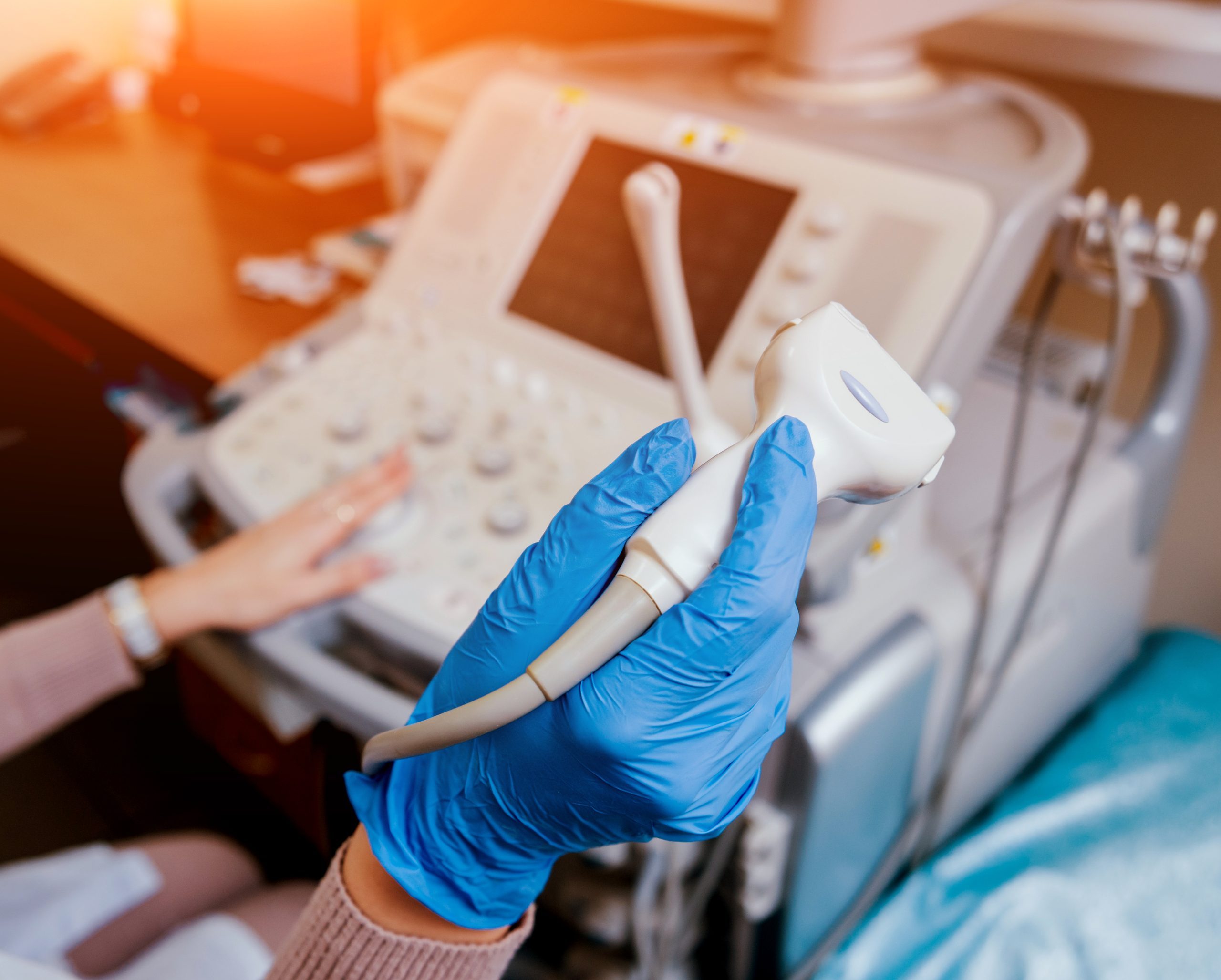 Ultrasound scanner in the hands of a doctor.