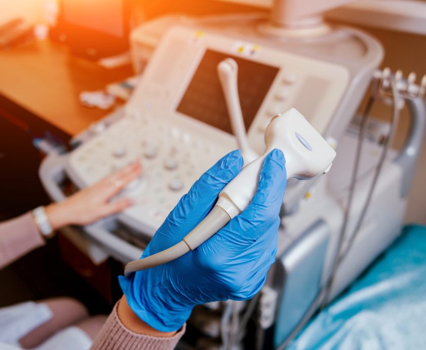 Ultrasound scanner in the hands of a doctor.